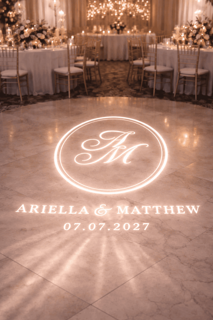Oval wedding monogram projected as a gobo light at wedding reception