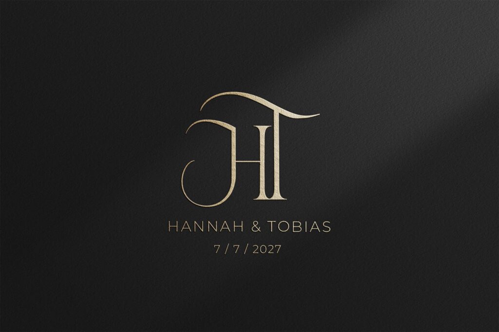 Couture wedding monogram logo in gold on premium black background